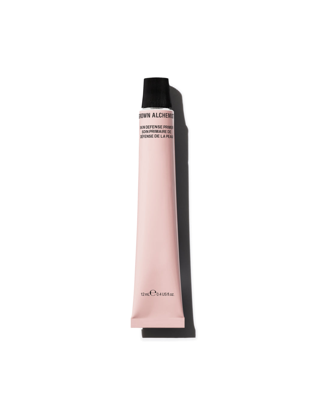 Pink cosmetic tube with black cap on a white background