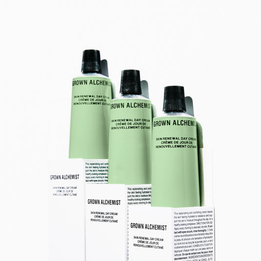 Three bottles of Grown Alchemist skin renewal day cream with a box on a white background