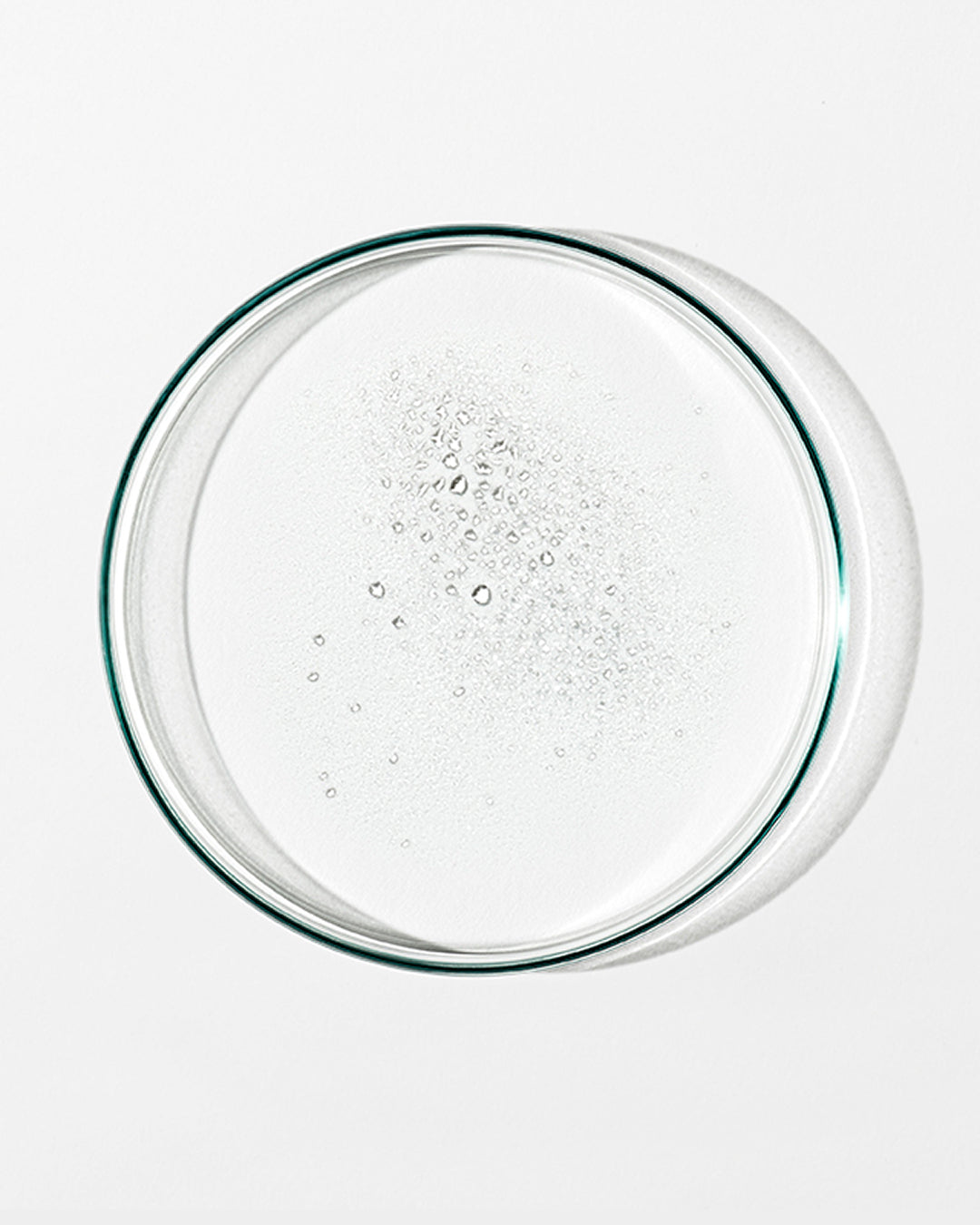 Clear glass lid with bubbles on a white background