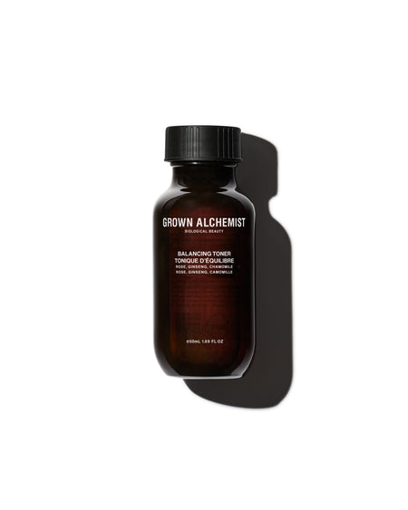 Brown bottle with black cap on a white background, featuring 'Grown Alchemist' branding.