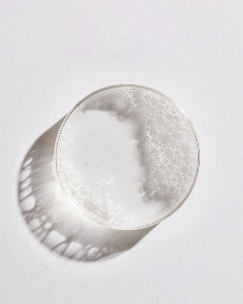 Silver bowl with textured surface on a white background