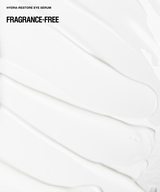 White cosmetic smear with black text reading 'HYDRA-RESTORE EYE SERUM' and 'FRAGRANCE-FREE' on a clean white background.
