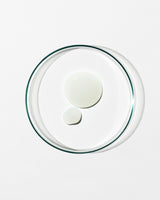 Clear glass lid with two white circular objects on a white background
