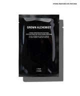 A single black Grown Alchemist Hydra-Restore Eye Patch sachet on a white background with a soft shadow.