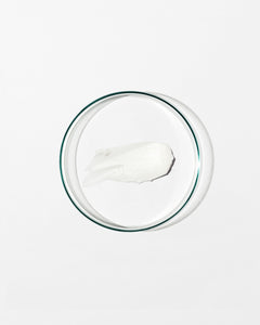 Swatch of regenerating moisturizer on white background.