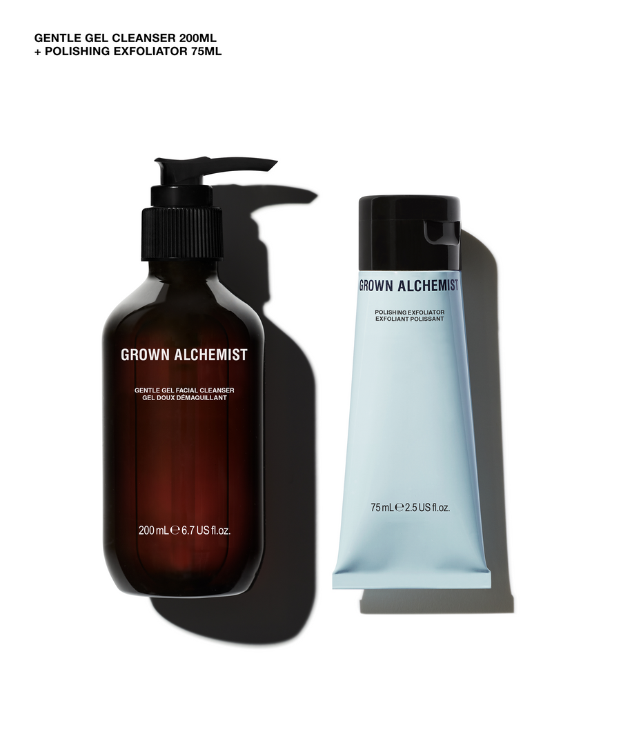 Grown Alchemist gentle gel cleanser 200ml in a dark amber pump bottle and polishing exfoliator 75ml in a light blue squeeze tube, shown on a white background with black shadows.