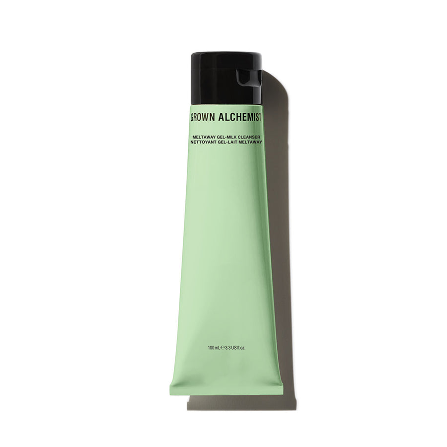A tube of Meltaway Gel-Milk Cleanser by Grown Alchemist with a light green hue and black cap.