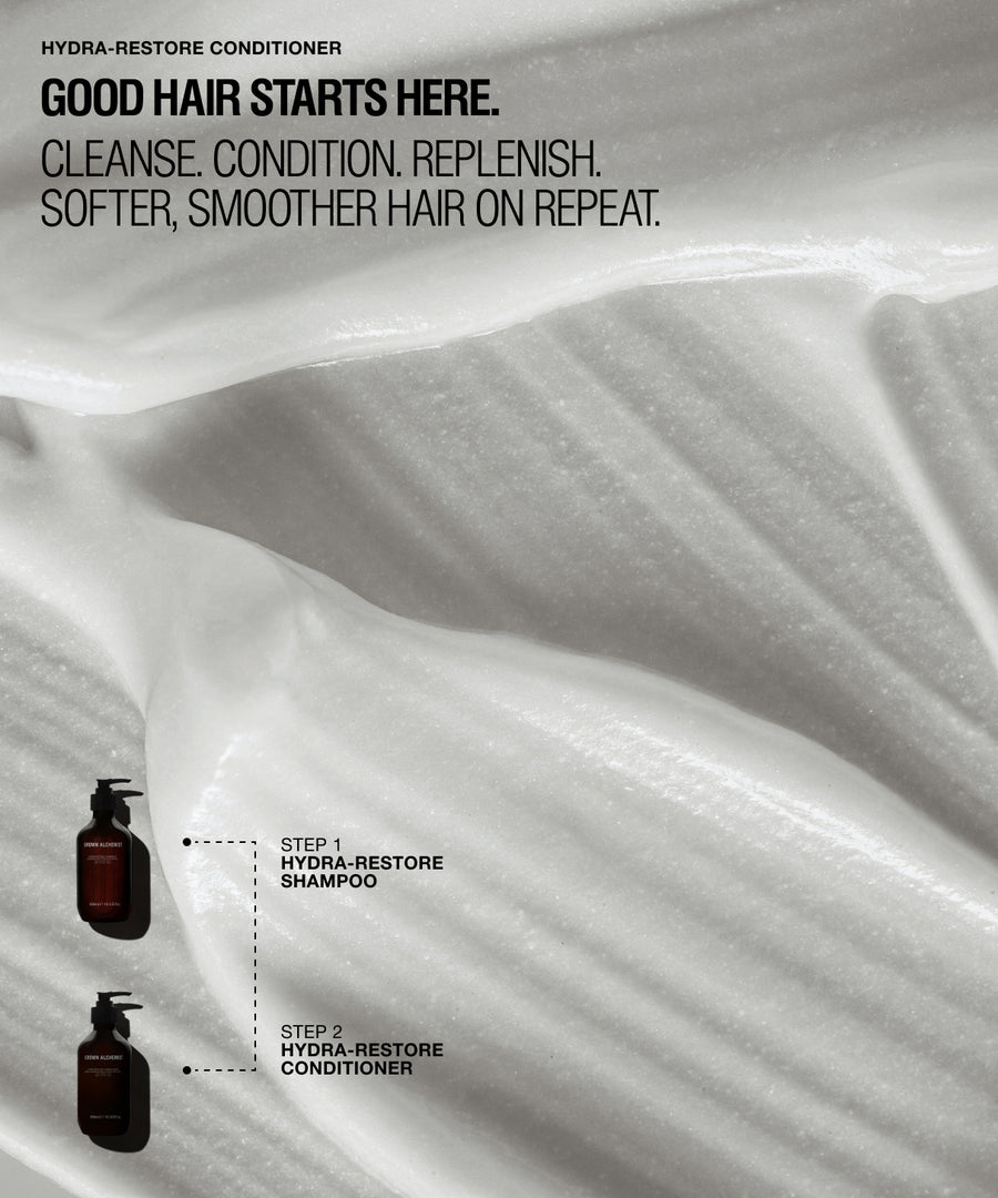 Promotional graphic for Hydra-Restore Conditioner showing a close-up of white whipped conditioner cream with text reading 'GOOD HAIR STARTS HERE.' and small dark bottles labeled Step 1 Hydra-Restore Shampoo and Step 2 Hydra-Restore Conditioner.