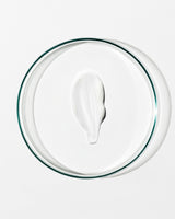 White cream on a clear glass plate with a white background