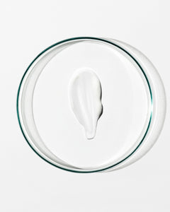 White cream on a clear glass plate with a white background