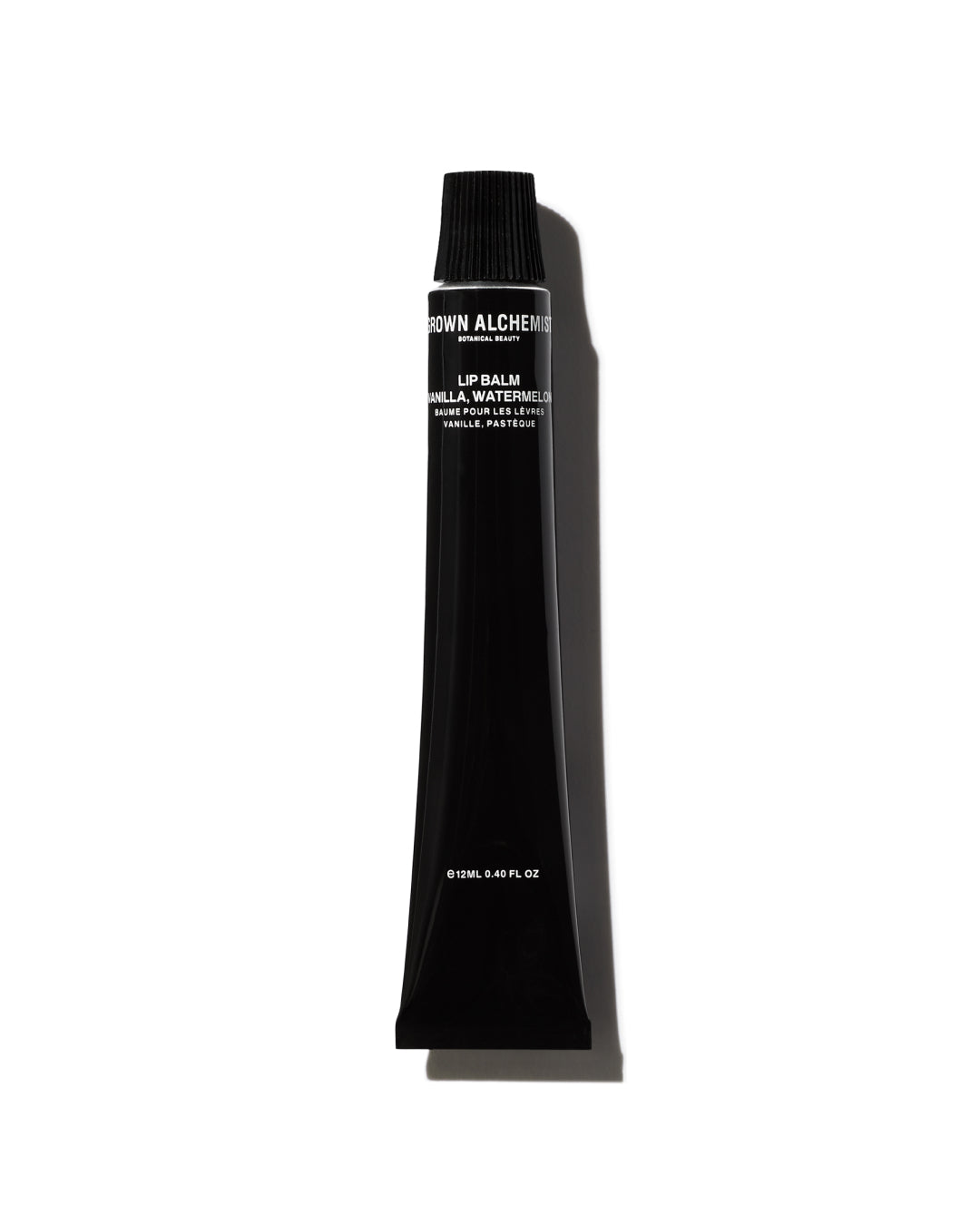 Black lip balm tube with brand name on a white background