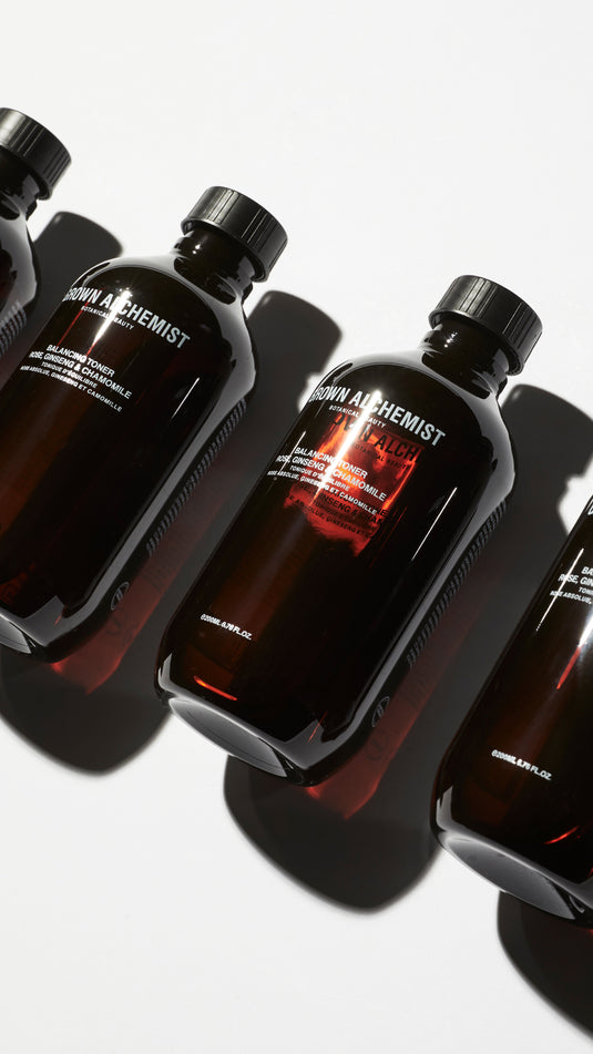 Three bottles of Grown Alchemist Balancing Toner on a white background