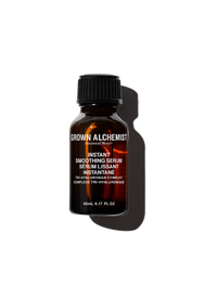 A bottle of Grown Alchemist Instant Smoothing Serum with a dark label and a clear, amber liquid visible inside.