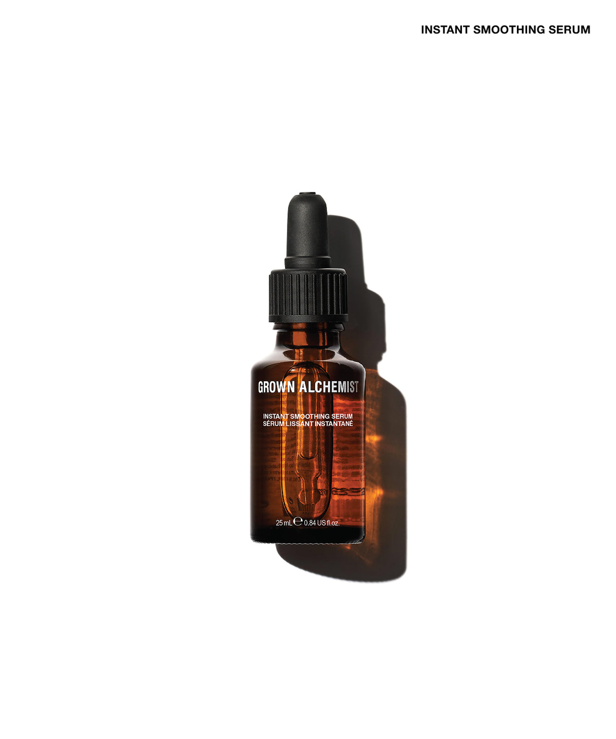A 30ml amber glass dropper bottle of Brown Alchemist Instant Smoothing Serum, shown on a clean white background with a soft shadow.
