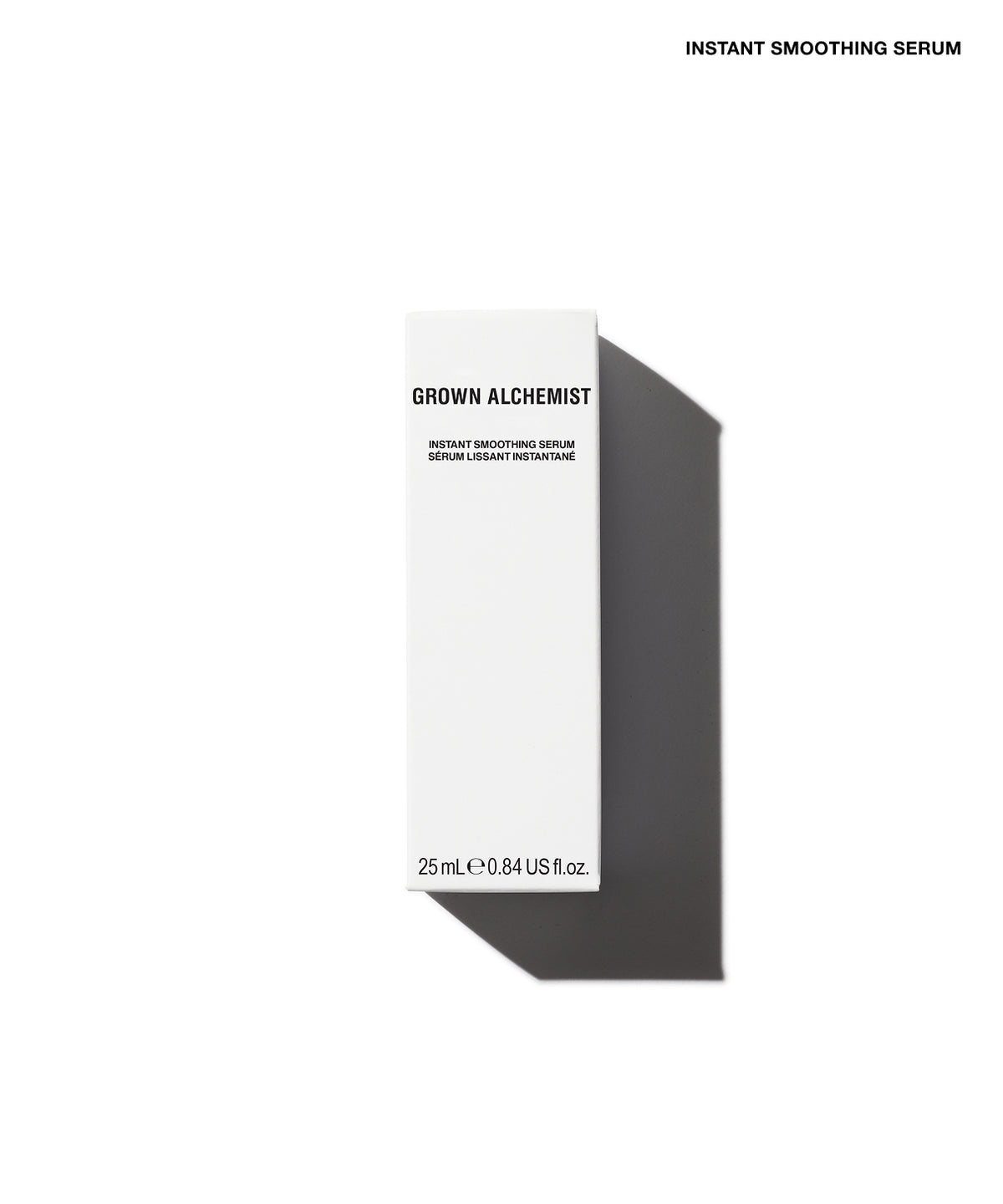A tall, slim white skincare box labeled 'GROWN ALCHEMIST' and 'INSTANT SMOOTHING SERUM' on a clean white background, with a dark gray shadow cast to the right. Small black text at the top reads 'INSTANT SMOOTHING SERUM'.