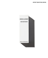 A tall, slim white skincare box labeled 'GROWN ALCHEMIST' and 'INSTANT SMOOTHING SERUM' on a clean white background, with a dark gray shadow cast to the right. Small black text at the top reads 'INSTANT SMOOTHING SERUM'.