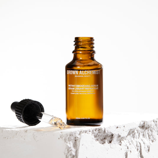 Instant Smoothing Serum bottle with dropper on a white background