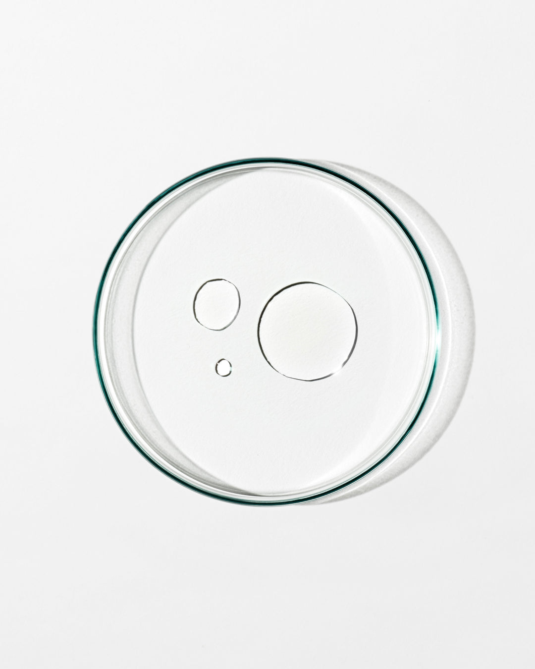 Clear glass pie dish lid on a white background