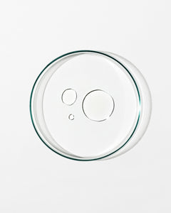 Clear glass pie dish lid on a white background