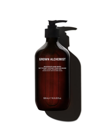 Brown bottle of Grown Alchemist hand wash on a white background