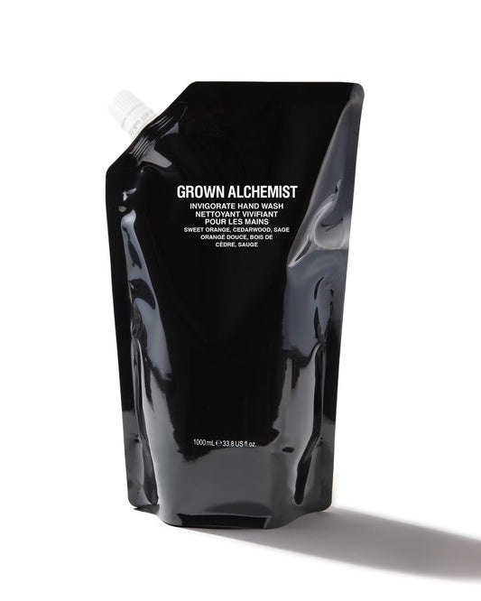 Black pouch of Grown Alchemist hand wash on a white background
