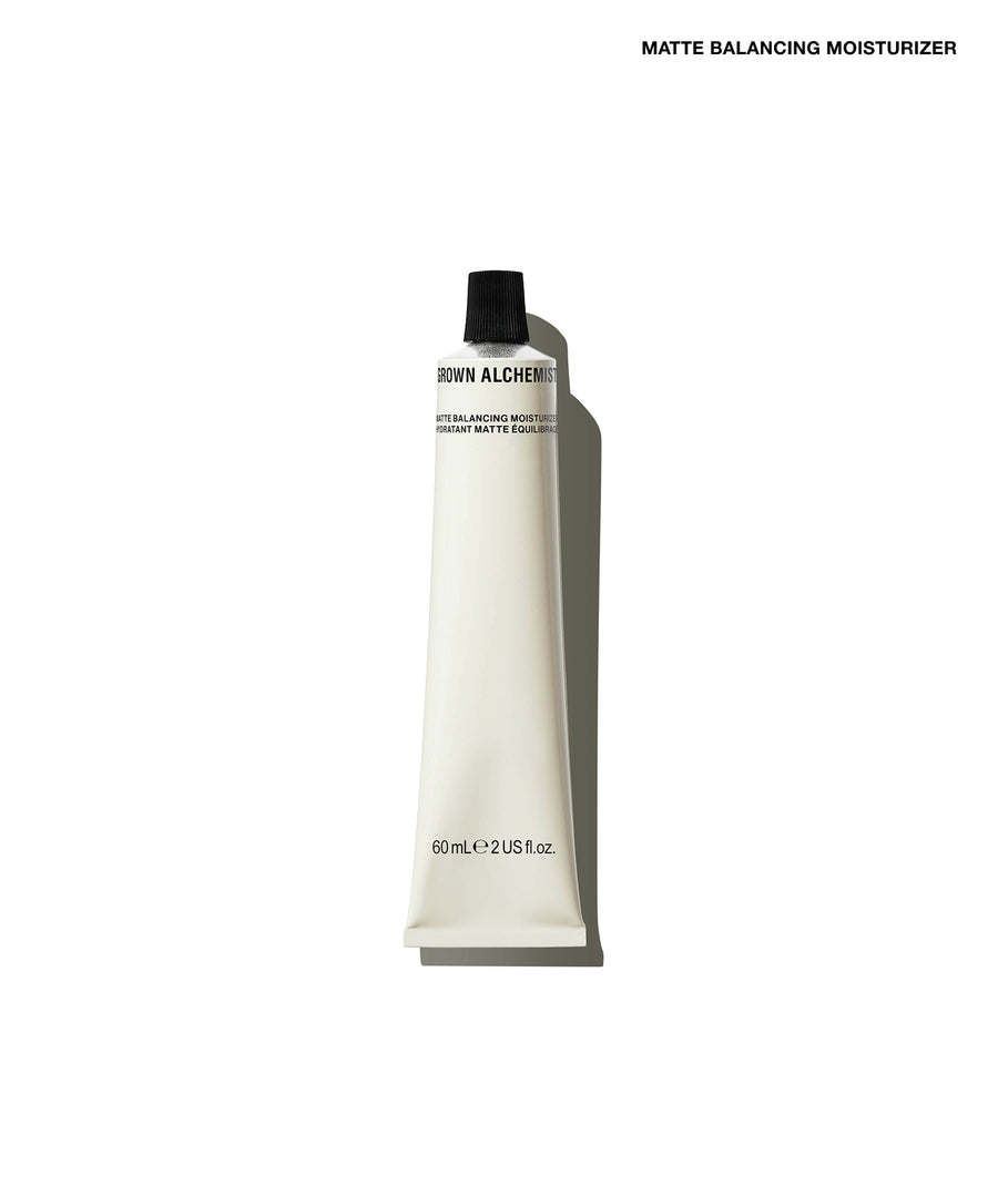 A white squeeze tube of Row Alcher Matte Balancing Moisturizer with a black cap, shown on a clean white background with a soft shadow.