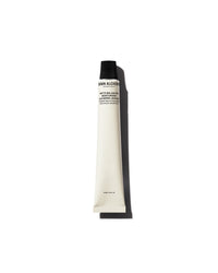 Tube of Grown Alchemist lotion on a white background