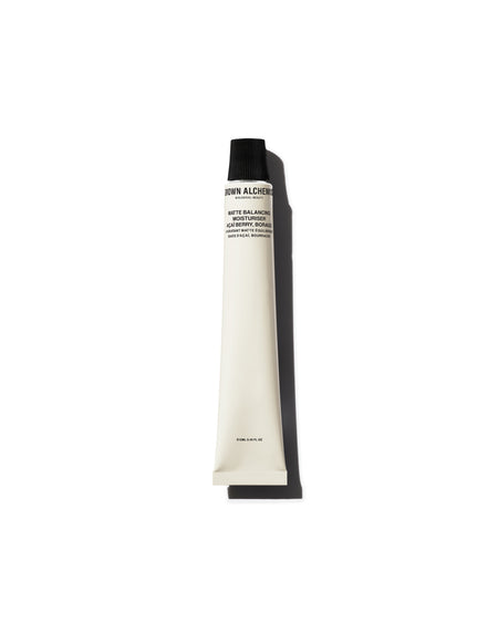 Tube of Grown Alchemist lotion on a white background
