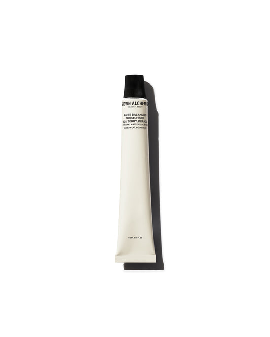 Tube of Grown Alchemist lotion on a white background