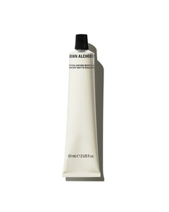 Tube of Grown Alchemist cream on a white background
