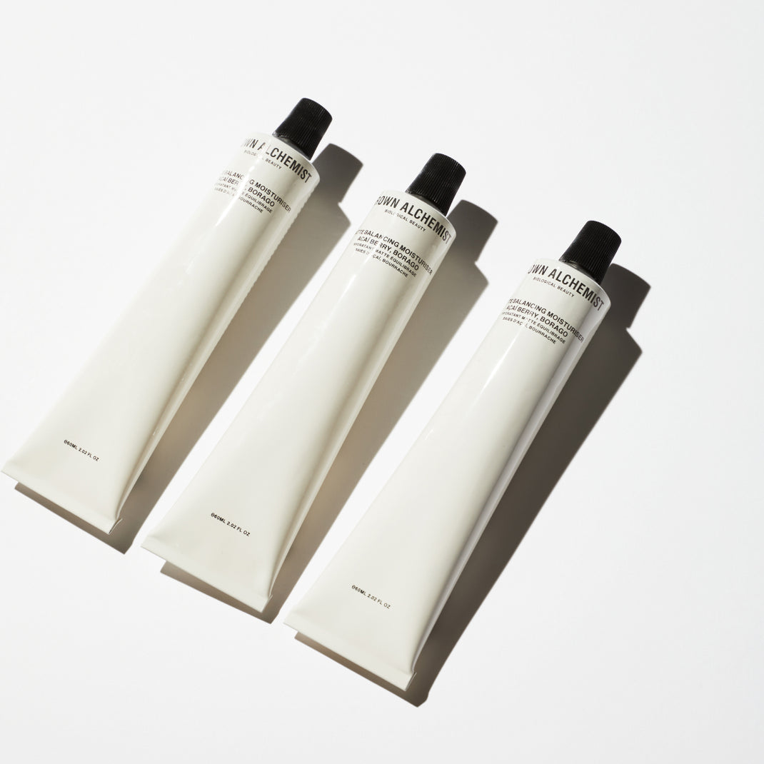 Three tubes of Matte Balancing Moisturizer on a white background