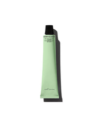 Green tube of cosmetic product on a white background