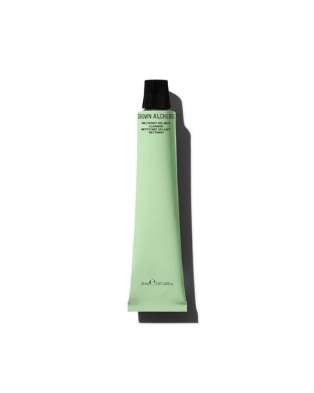 Green tube of cosmetic product on a white background