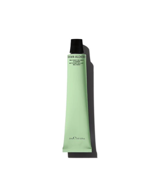 Green tube of cosmetic product on a white background