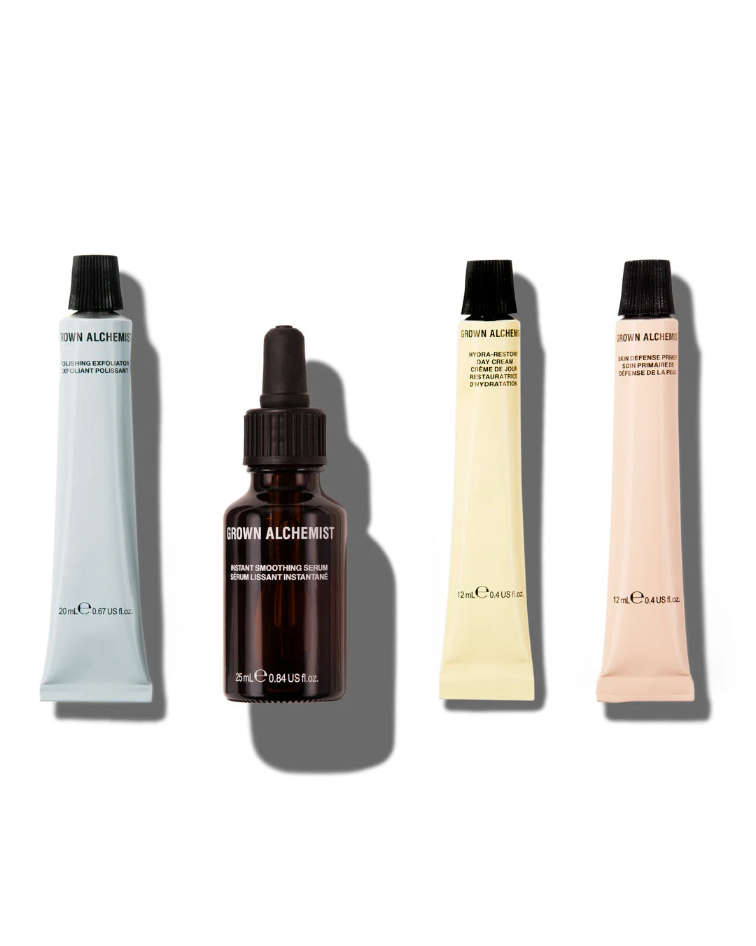 Set of four skincare products from the brand 'Grown Alchemist' on a white background