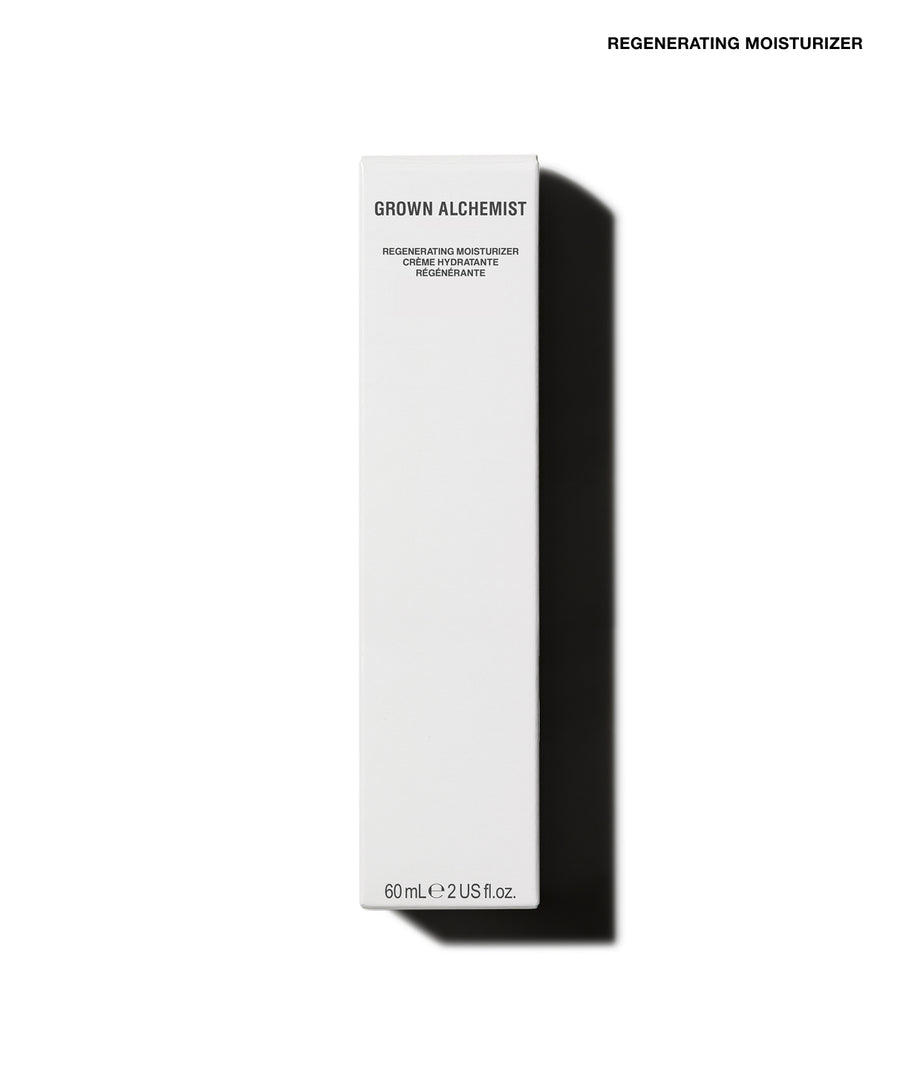 A tall, narrow white rectangular box for Grown Alchemist Regenerating Moisturizer, shown on a clean white background with a strong black shadow to the right. Small black text at the top right reads 'REGENERATING MOISTURIZER'.