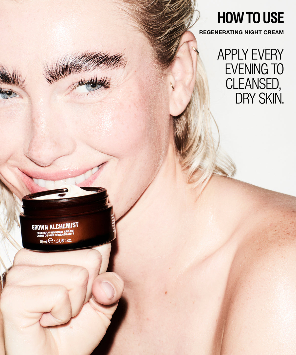 A close-up lifestyle shot of a smiling blonde woman holding a dark brown jar of GROWN ALCHEMIST Regenerating Night Cream against a clean white background with text instructions on how to use the cream.