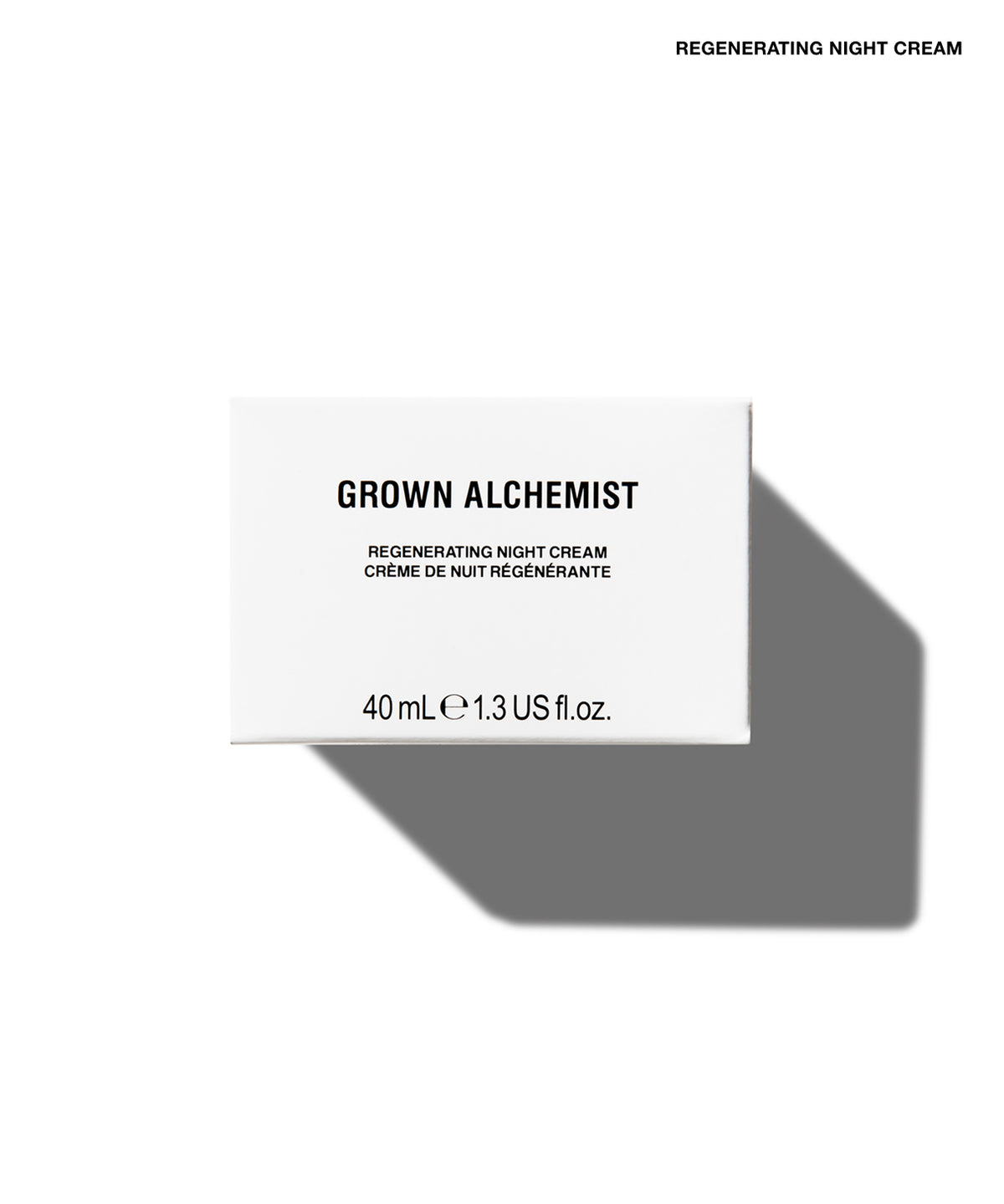 A white rectangular product box for Grown Alchemist Regenerating Night Cream, shown on a white background with a soft gray shadow. The box features black text and is positioned in the lower half of the frame.