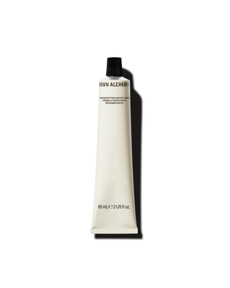 White cosmetic tube with black cap on a white background