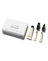 Skincare product set with bottles and tubes on a white background
