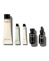 Set of 5 skincare products from Grown Alchemist on a white background -Hydra Restore Cream cleanser, regenerating gel mask, hydra-restore day cream, gentle gel facial cleanser, skin renewal facial oil.