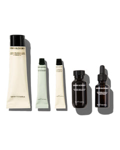 Set of 5 skincare products from Grown Alchemist on a white background -Hydra Restore Cream cleanser, regenerating gel mask, hydra-restore day cream, gentle gel facial cleanser, skin renewal facial oil.