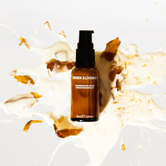 Regenerating Serum bottle on a white background with decorative elements