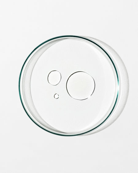 Clear glass lid with a green rim on a white background