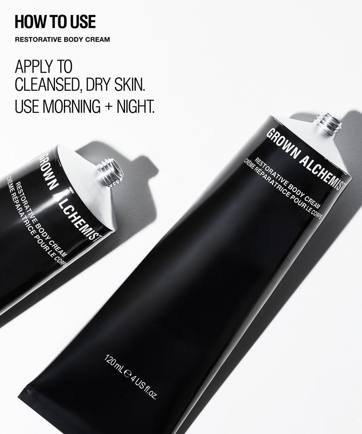 Two black tubes of Grown Alchemist Restorative Body Cream on a white background with 'HOW TO USE' text on the left.