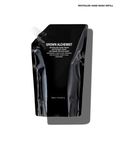 A black refill pouch of Grown Alchemist Revitalize Hand Wash on a white background with a gray shadow.