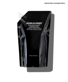 A black refill pouch of Grown Alchemist Revive Body Cleanser on a white background with a gray shadow. The text 'REVIVE BODY CLEANSER REFILL' is visible at the top right.