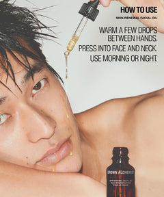 A close-up skincare instructional graphic showing a man's face with wet hair, a dropper above his face, and a small brown bottle labeled Grown Alchemist. Text reads: 'HOW TO USE SKIN RENEWAL FACIAL OIL' and instructions on applying the oil.