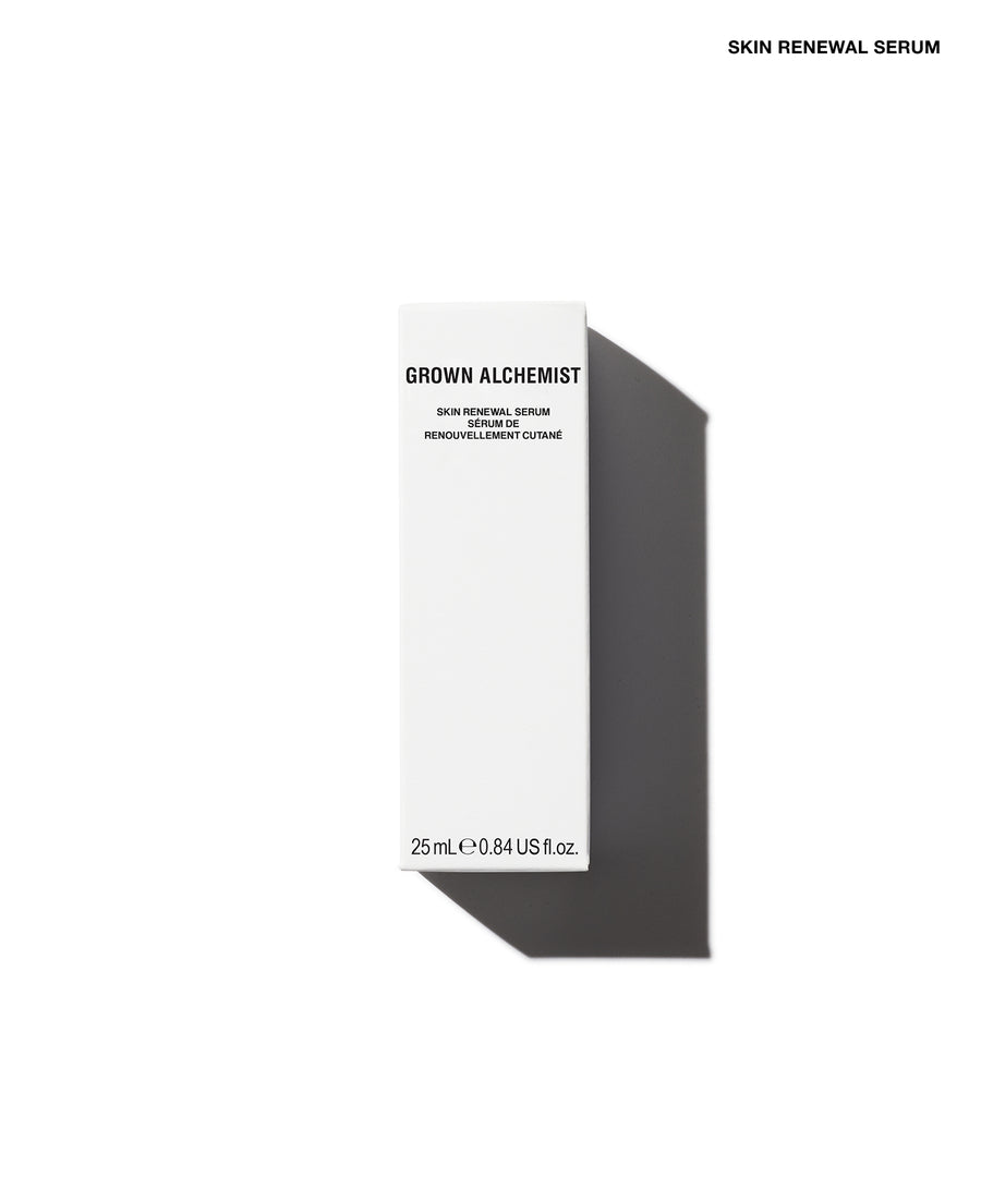A tall, slim white skincare bottle labeled 'GROWN ALCHEMIST' and 'SKIN RENEWAL SERUM' on a clean white background with a dark gray shadow cast to the right.