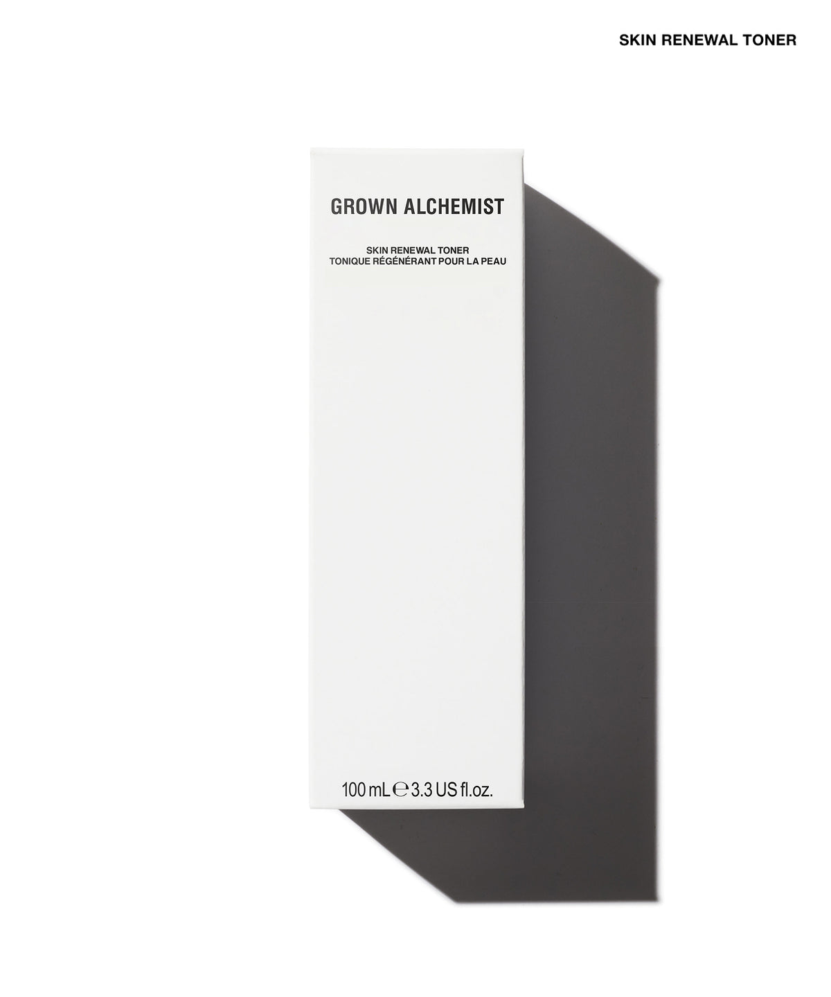 A tall, minimalist white rectangular box for Grown Alchemist Skin Renewal Toner, shown on a clean white background with a sharp dark shadow to the right. The box features black text including the brand name 'GROWN ALCHEMIST' and product name 'SKIN RENEWAL TONER'.